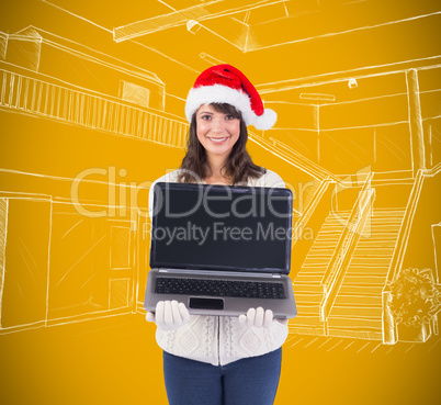 Composite image of smiling brunette in santa hat showing her lap