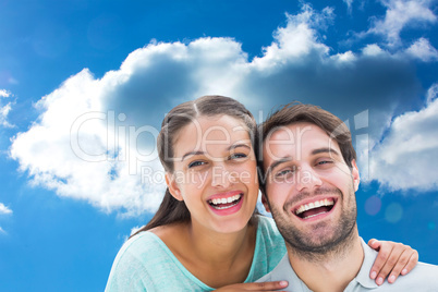 Composite image of cute couple smiling at camera