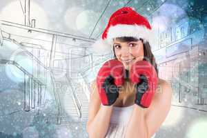 Composite image of festive brunette with boxing gloves