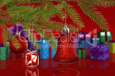 Composite image of red decorations on branch