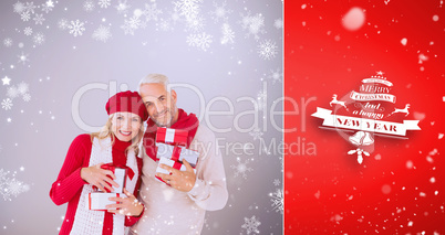 Composite image of happy festive couple with gifts