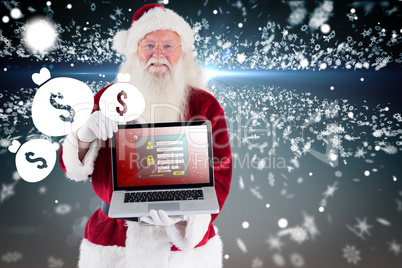 Composite image of santa claus presents a laptop