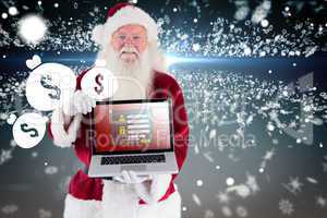 Composite image of santa claus presents a laptop