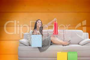 Composite image of woman lying on couch