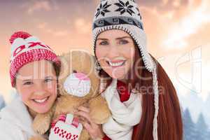 Composite image of mother and daughter with teddy