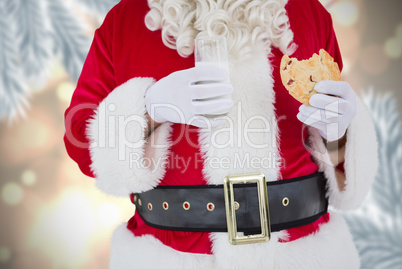 Composite image of santa having milk and cookie