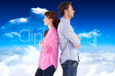 Composite image of irritated couple ignoring each other