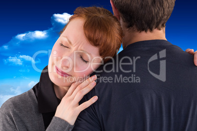 Composite image of scared woman holding onto man