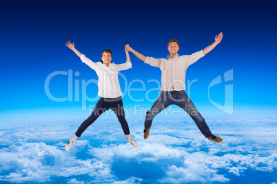 Composite image of couple jumping and holding hands