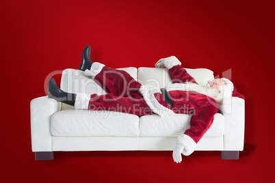 Composite image of santa claus taking a nap