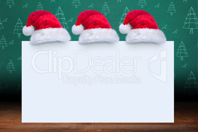 Composite image of santa hat on poster