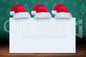 Composite image of santa hat on poster