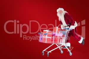 Composite image of santa rides on a shopping cart