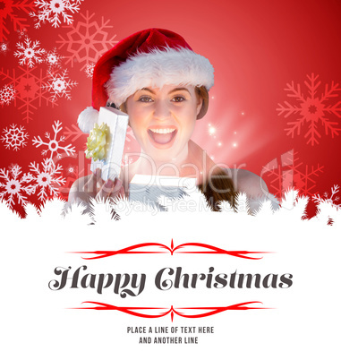 Composite image of sexy girl in santa costume opening a gift