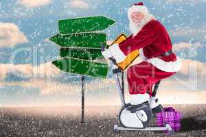 Composite image of santa uses a home trainer