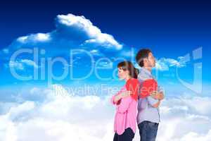 Composite image of couple holding a broken heart