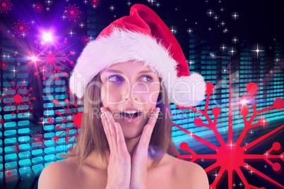 Composite image of festive brunette looking surprised with hands