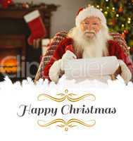 Composite image of happy santa writing list with a quill