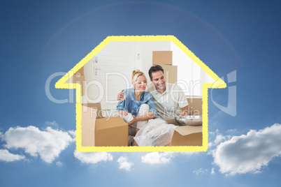 Composite image of smiling couple unpacking boxes in a new house Composite image of smiling couple unpacking boxes in a new house