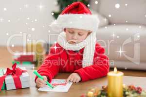 Composite image of festive little boy drawing pictures