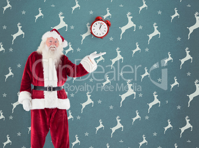 Composite image of santa shows something to camera