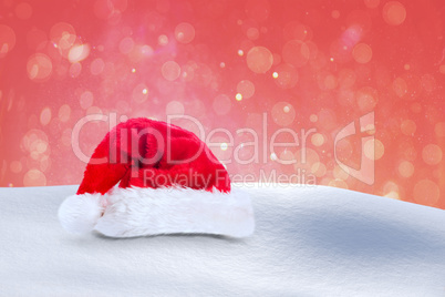 Composite image of santa hat on snow Composite image of santa hat on snow