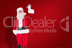 Composite image of cheerful santa claus waving