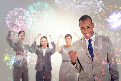 Composite image of successful business team with a man in the fo