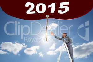 Composite image of businessman climbing up ladder