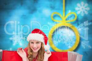 Composite image of smiling woman lying between sale shopping bag