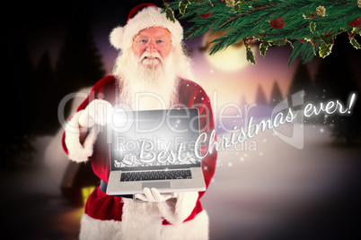 Composite image of santa claus presents a laptop