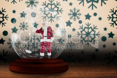 Santa presenting in a snow globe