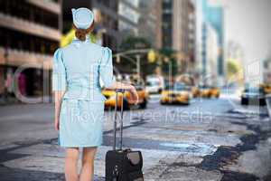 Composite image of pretty air hostess leaning on suitcase