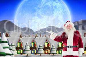 Composite image of santa shows something to camera