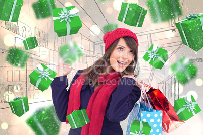 Composite image of happy brunette in winter clothes holding shop