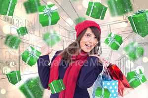 Composite image of happy brunette in winter clothes holding shop