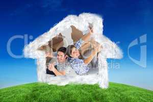 Composite image of overview of a happy couple giving thumbs up