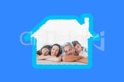 Composite image of beautiful family in sitting room smiling