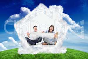 Composite image of man and his wife looking at their house plans