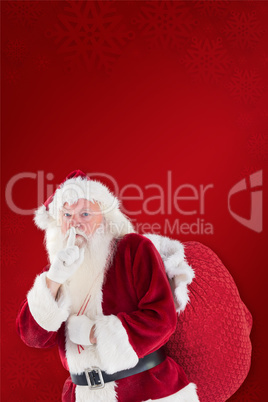 Composite image of santa asking for quiet with bag