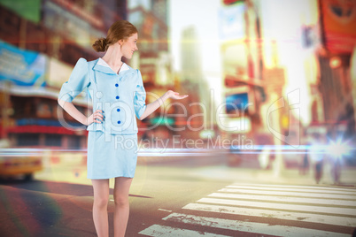 Composite image of pretty air hostess presenting with hand