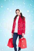 Composite image of happy brunette in winter clothes holding shop