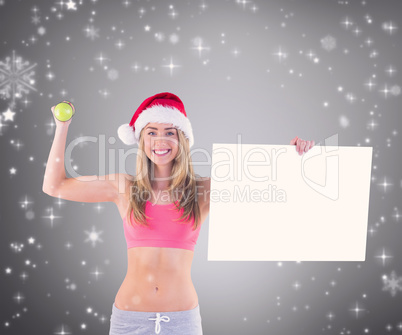 Composite image of festive fit blonde showing poster
