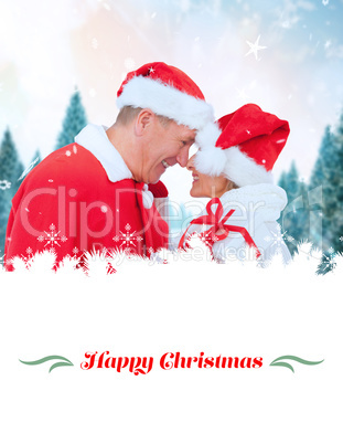 Composite image of festive mature couple holding gift