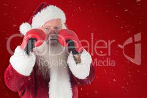 Composite image of santa claus is ready to fight