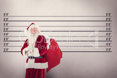 Composite image of santa carries his red bag