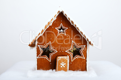 The hand-made eatable gingerbread house and snow decoration