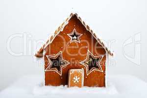 The hand-made eatable gingerbread house and snow decoration