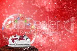 Composite image of santa sleeping in snow globe