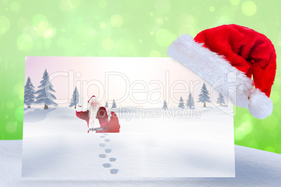 Composite image of santa delivery presents to village